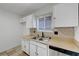 Kitchen featuring stainless steel appliances, a window and neutral backsplash at 6205 Parsifal Pl, Las Vegas, NV 89107