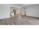 The living room features light, bright walls and wood laminate flooring at 6205 Parsifal Pl, Las Vegas, NV 89107