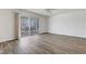 The living room features light, bright walls and wood laminate flooring at 6205 Parsifal Pl, Las Vegas, NV 89107