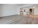 The living room features light, bright walls and wood laminate flooring at 6205 Parsifal Pl, Las Vegas, NV 89107