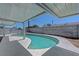 Covered swimming pool perfect for relaxing and staying cool at 6205 Parsifal Pl, Las Vegas, NV 89107