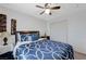 Inviting bedroom featuring a ceiling fan, closet, stylish decor, and calming blue bedding at 6276 Point Isabel Way, Las Vegas, NV 89122