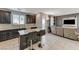 Modern kitchen featuring dark cabinetry, stainless steel appliances, and a granite island at 6276 Point Isabel Way, Las Vegas, NV 89122