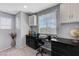 Office space with built-in desk, drawers, cabinets, neutral carpet, and window with natural light at 6276 Point Isabel Way, Las Vegas, NV 89122
