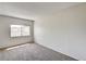A bright bedroom featuring carpet and a window, offers a serene retreat at 6641 Silverstream Ave # C, Las Vegas, NV 89107