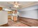 Bright living room showcasing an open floor plan, wood-look floors, and natural light at 6641 Silverstream Ave # C, Las Vegas, NV 89107
