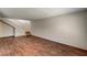 Spacious living room showcasing hardwood floors and staircase at 6641 Silverstream Ave # C, Las Vegas, NV 89107