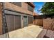 Private patio space that includes secure gate, and building exterior at 6641 Silverstream Ave # C, Las Vegas, NV 89107