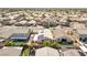 An elevated view displaying backyard pool, mature trees, and ample patio space at 7070 Cinder Horse St, Las Vegas, NV 89131