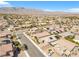 An aerial perspective of a desert community with mountain views at 7070 Cinder Horse St, Las Vegas, NV 89131