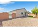 Backyard featuring gravel area, privacy wall, and a small section of artificial turf at 7070 Cinder Horse St, Las Vegas, NV 89131