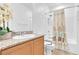 Bright bathroom featuring granite counters, shower/tub combo, and tiled flooring at 7070 Cinder Horse St, Las Vegas, NV 89131