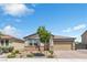 Charming single story home with desert landscaping, brick driveway, and a two car garage in a suburban neighborhood at 7070 Cinder Horse St, Las Vegas, NV 89131