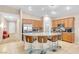 Spacious kitchen featuring granite countertops, stainless steel appliances, a pantry, and a breakfast bar at 7070 Cinder Horse St, Las Vegas, NV 89131