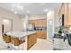Open kitchen featuring a granite island with bar seating, stainless appliances, and a walk-in pantry at 7070 Cinder Horse St, Las Vegas, NV 89131