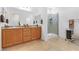 Bathroom with double vanity, walk-in shower, and granite countertops at 7070 Cinder Horse St, Las Vegas, NV 89131