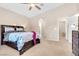 Bedroom with soft carpet, ceiling fan and ensuite at 7070 Cinder Horse St, Las Vegas, NV 89131