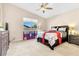 Vaulted ceiling bedroom featuring a full bed, window view and soft carpet at 7070 Cinder Horse St, Las Vegas, NV 89131