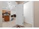 Half bathroom showcases a white door, toilet and pedestal sink at 7070 Cinder Horse St, Las Vegas, NV 89131