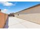 Side yard with a concrete surface alongside a privacy wall and gate at 7070 Cinder Horse St, Las Vegas, NV 89131
