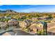 Aerial view of a suburban neighborhood, with mountain views and well-maintained landscaping at 724 Step Beach St, Las Vegas, NV 89138