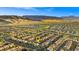 An aerial view pinpoints a house in a community with mountains at 724 Step Beach St, Las Vegas, NV 89138