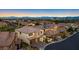 Aerial view of suburban homes with mountain views and tile roofs at 724 Step Beach St, Las Vegas, NV 89138