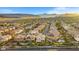 Expansive aerial view of a community with mountains in the background at 724 Step Beach St, Las Vegas, NV 89138
