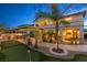 Luxurious backyard with a putting green, outdoor bar area, and ample space for entertainment and relaxation at 724 Step Beach St, Las Vegas, NV 89138
