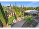 Aerial view of backyard featuring a putting green, outdoor living area, and mature landscaping at 724 Step Beach St, Las Vegas, NV 89138