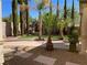 Serene backyard featuring turf lawn, decorative gravel and pavers, and privacy landscaping at 724 Step Beach St, Las Vegas, NV 89138