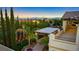 Lush backyard featuring a putting green, mature landscaping, and an outdoor living area at 724 Step Beach St, Las Vegas, NV 89138