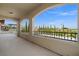 Covered balcony with large archways revealing views of the neighborhood and mountains at 724 Step Beach St, Las Vegas, NV 89138