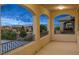 Covered balcony showcasing three archways with views of the city and surrounding landscape at 724 Step Beach St, Las Vegas, NV 89138