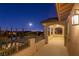 Spacious balcony with covered seating area offering stunning city views at night, perfect for relaxation and entertaining at 724 Step Beach St, Las Vegas, NV 89138