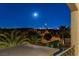 Balcony view of the lit up skyline with palm trees at 724 Step Beach St, Las Vegas, NV 89138