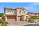 Beautiful two-story home with stone accents, landscaping, and a two-car garage at 724 Step Beach St, Las Vegas, NV 89138