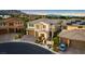 Aerial view of homes featuring stone accents, multi-car garages, and landscaped front yards at 724 Step Beach St, Las Vegas, NV 89138