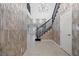 Spacious foyer with beautiful staircase, chandelier, modern wallpaper, and tile flooring at 724 Step Beach St, Las Vegas, NV 89138