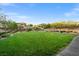 A large green space with lush grass, trees, and walking path at 724 Step Beach St, Las Vegas, NV 89138