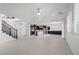 Open floor plan featuring staircase, dining area, large-format tile floors, and kitchen island at 724 Step Beach St, Las Vegas, NV 89138