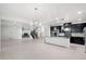 Open floor plan showcasing dining area, kitchen island, fireplace, and large-format tile floors at 724 Step Beach St, Las Vegas, NV 89138