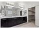 Modern bathroom features a double vanity, large mirror and a walk-in closet at 724 Step Beach St, Las Vegas, NV 89138