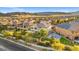Scenic view of a well-maintained neighborhood nestled against the backdrop of mountains at 724 Step Beach St, Las Vegas, NV 89138