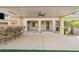 Covered outdoor kitchen with barstool seating and view of a putting green at 724 Step Beach St, Las Vegas, NV 89138