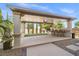 Backyard featuring a covered outdoor kitchen with barstool seating at 724 Step Beach St, Las Vegas, NV 89138