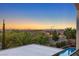 Sunset view from balcony showcasing a pool and the city skyline in the distance at 724 Step Beach St, Las Vegas, NV 89138
