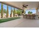 Outdoor entertainment area including a putting green, fountain and covered patio at 724 Step Beach St, Las Vegas, NV 89138
