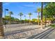 Enjoy a friendly game on the community volleyball court, set against a backdrop of palm trees and greenery at 724 Step Beach St, Las Vegas, NV 89138