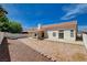View of the backyard with patio and minimal landscaping at 7927 W Oquendo Rd, Las Vegas, NV 89113